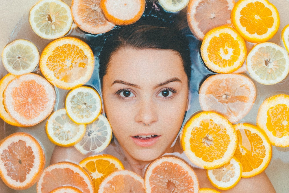 woman floating in citrus spa treatment